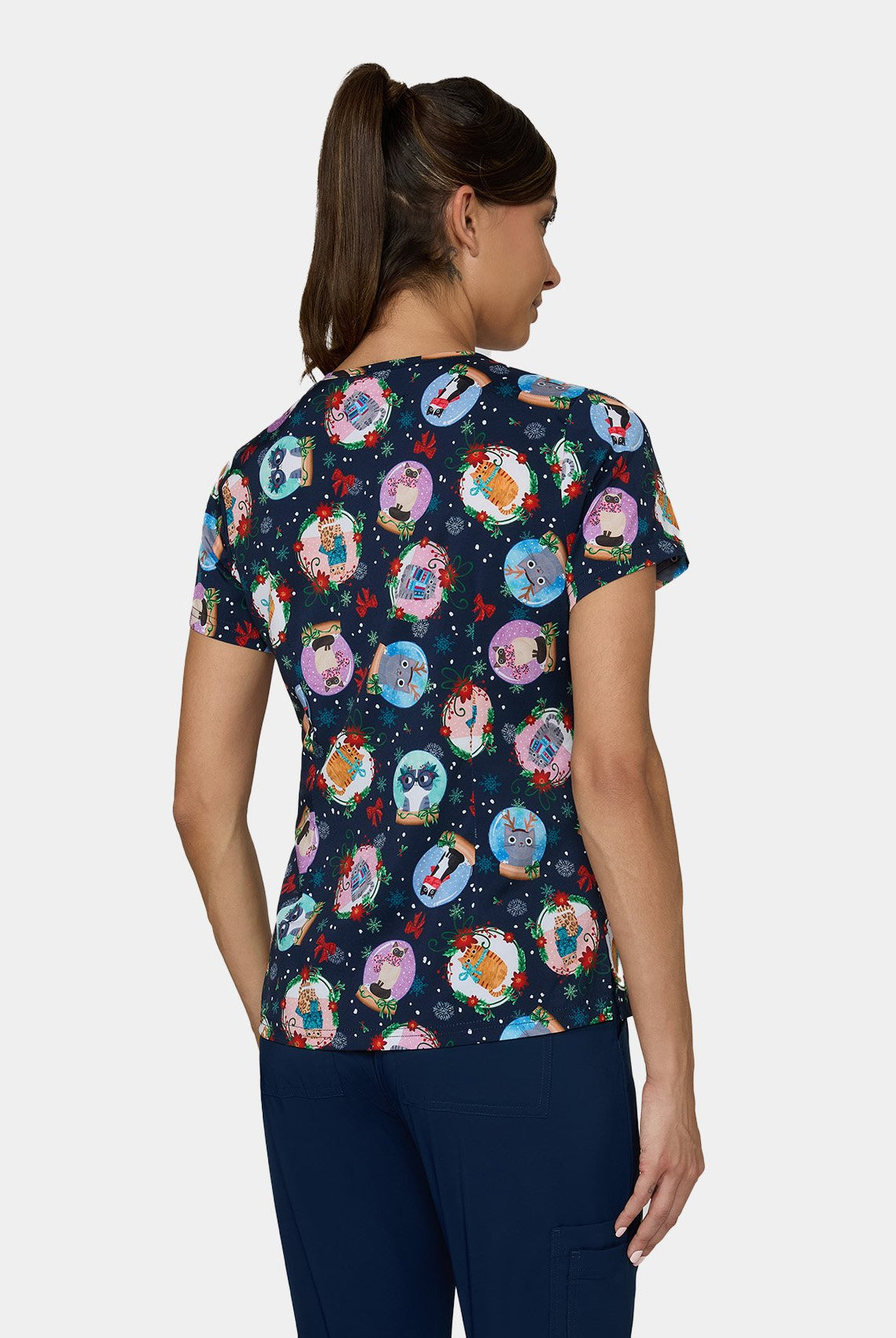 Back view of Koi Basics Leslie scrub top ā Holiday Cats print