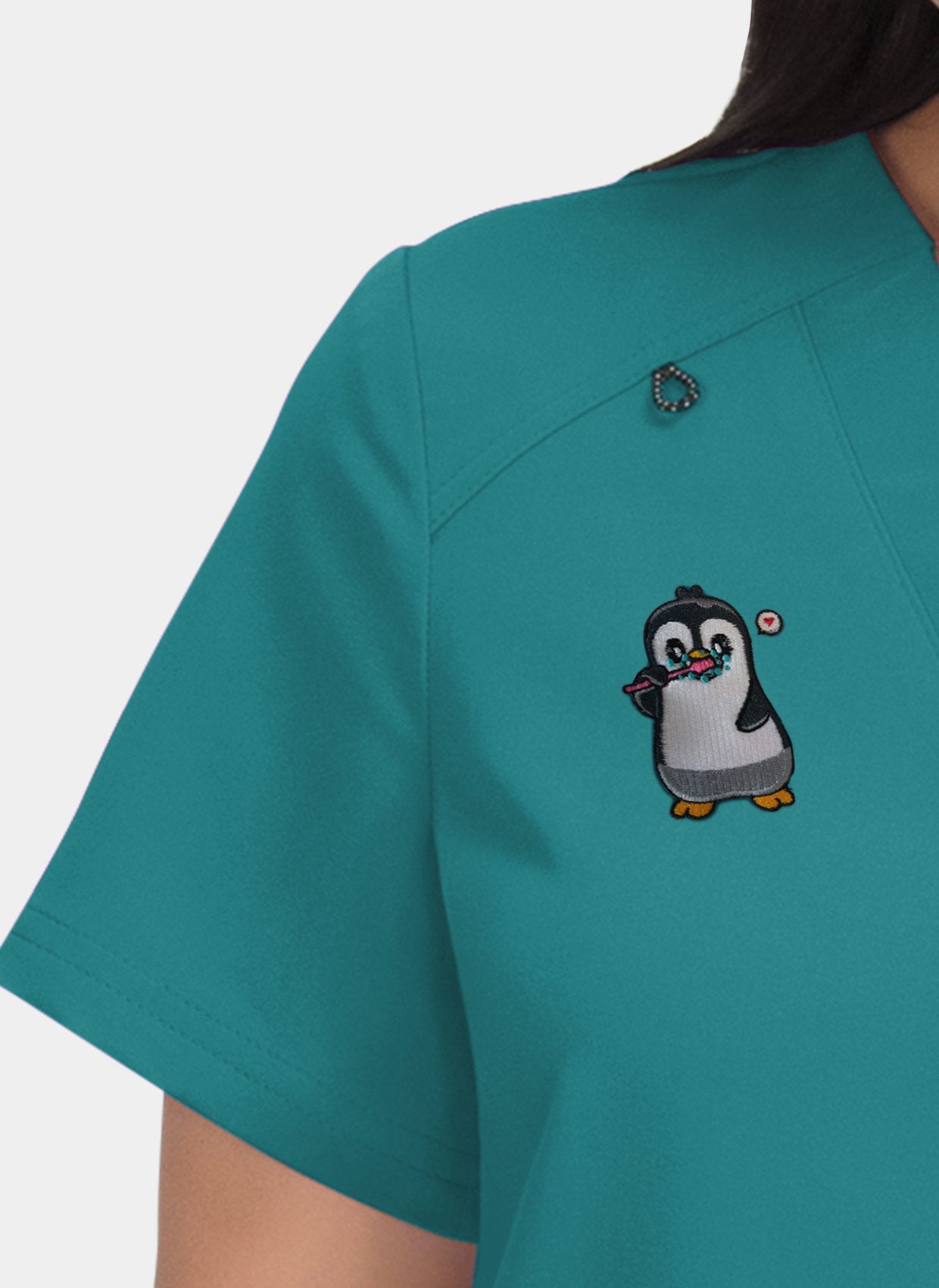 Hustle and heart teal embroidery close-up